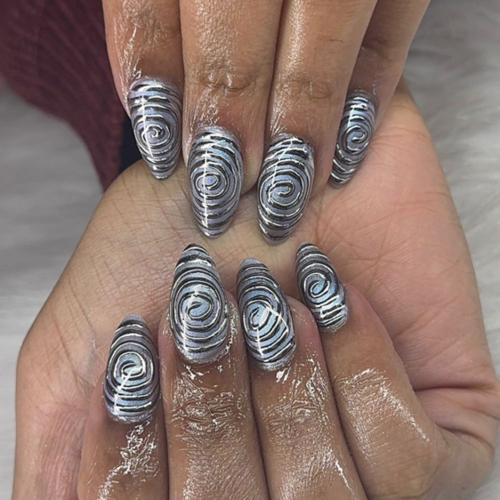Silver swirl nail art
